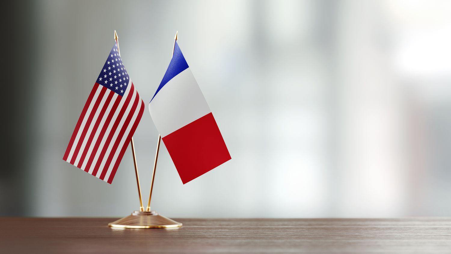 American and french flag pair on a desk over defocused background 913980748 5c703a8ccff47e0001b1e2f2